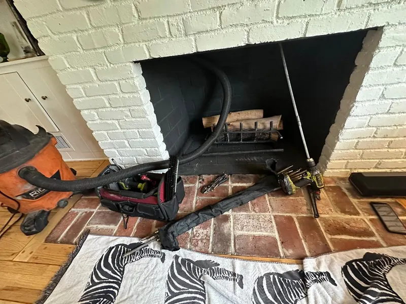 White brick fireplace and hearth cleaned down