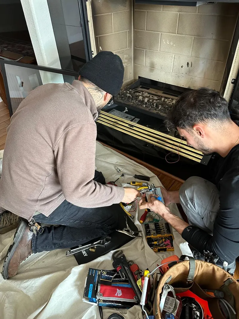 Firebox repair in progress with damaged brick cut out