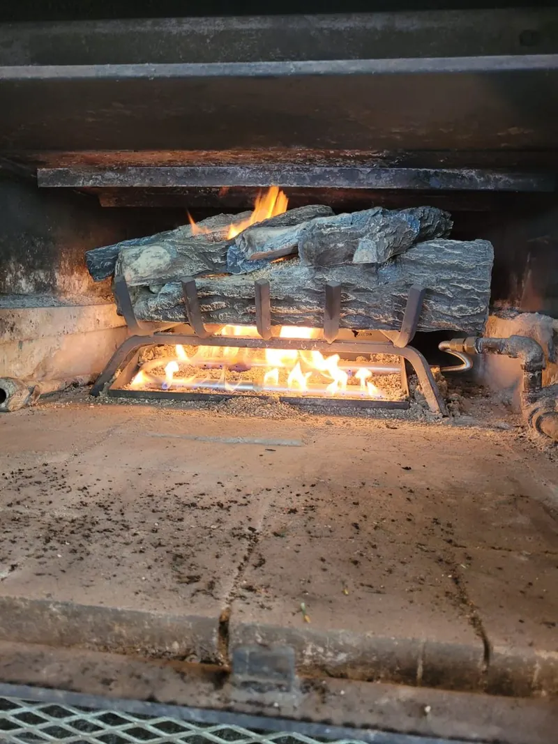 Gas log set serviced, cleaned and the flame pattern checked